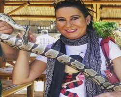 She is an animal lover and don't afraid to hold even a python.